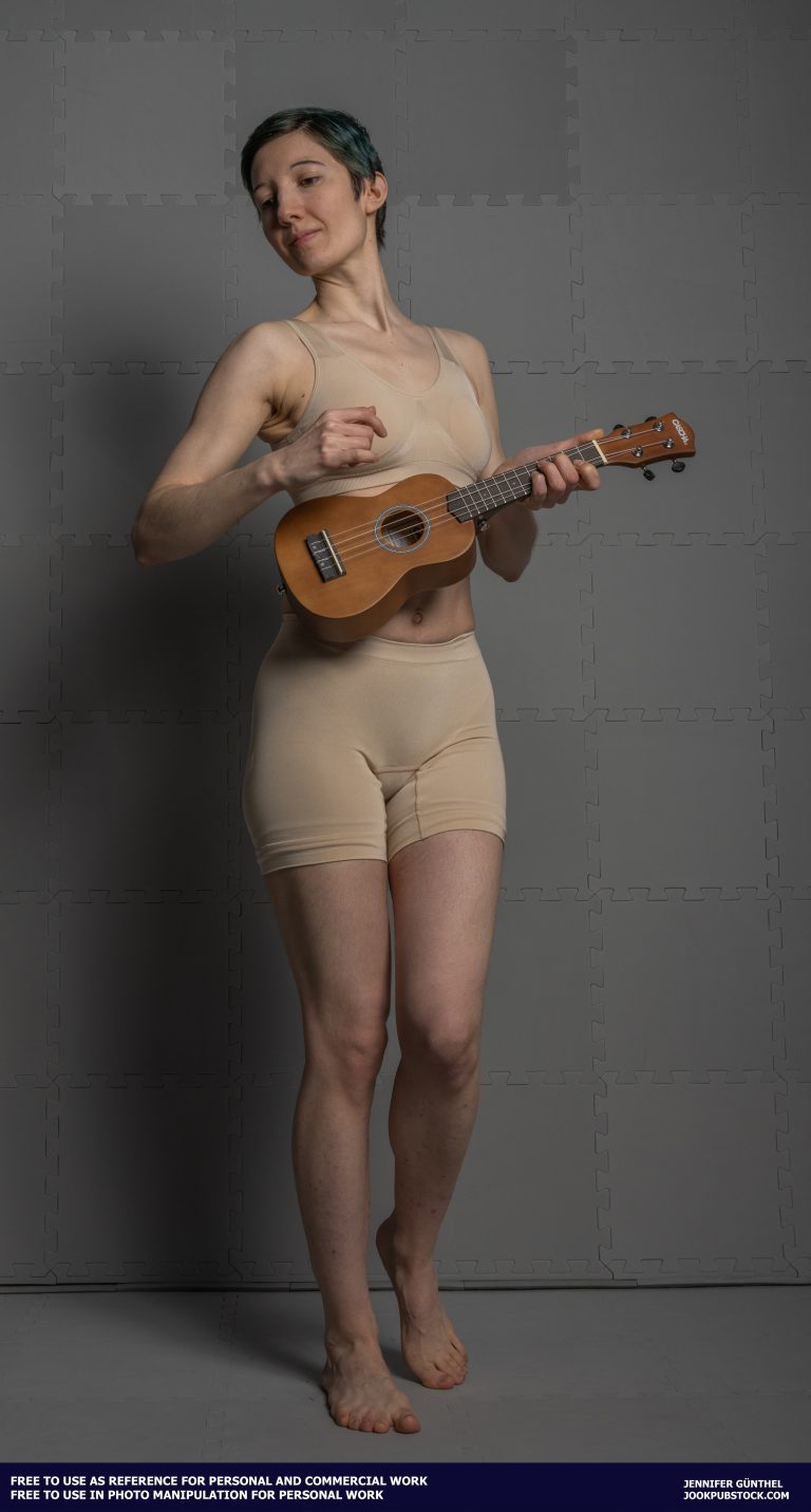 a person in underwear playing a ukulele