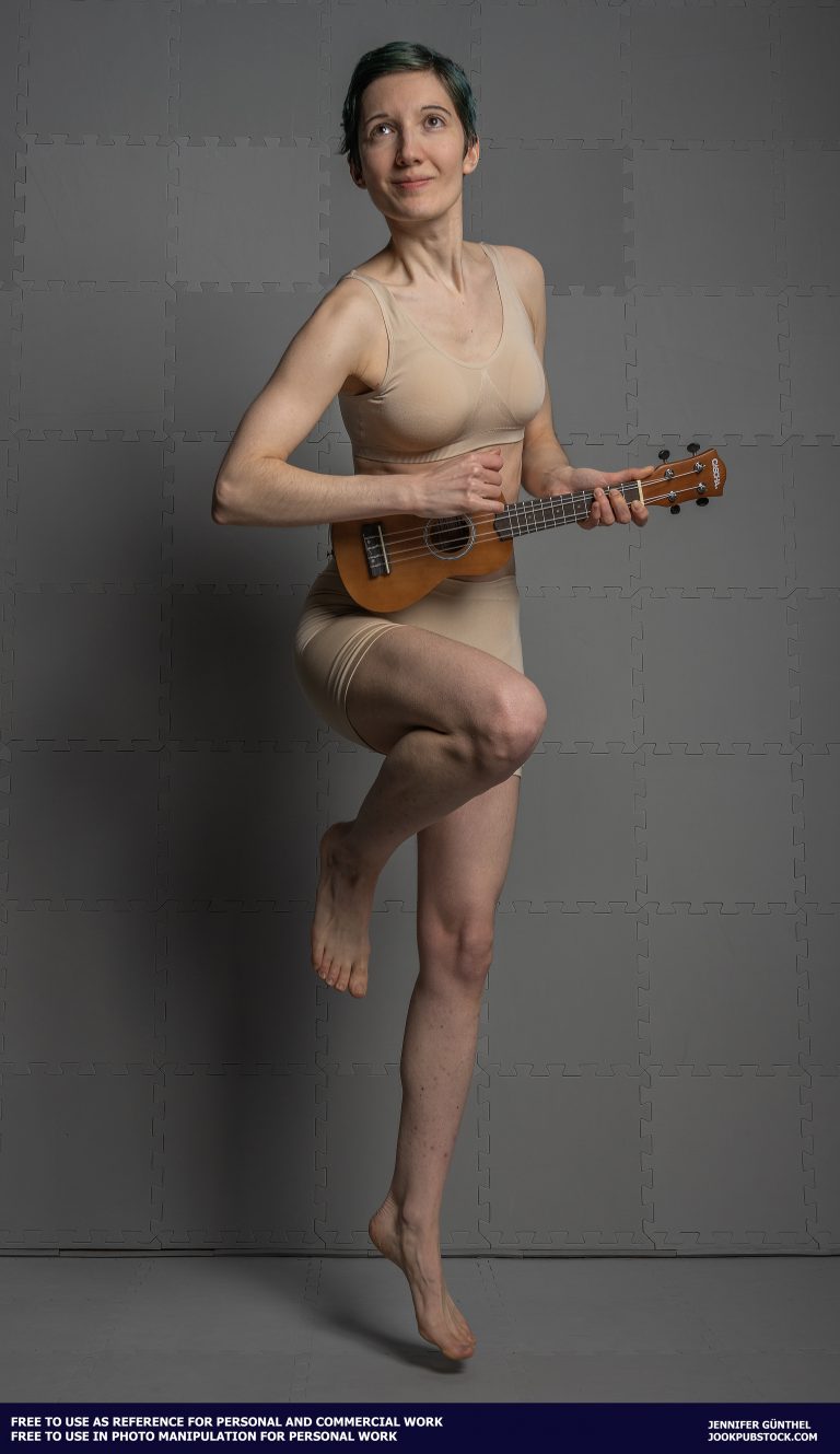 a person in underwear playing a ukulele