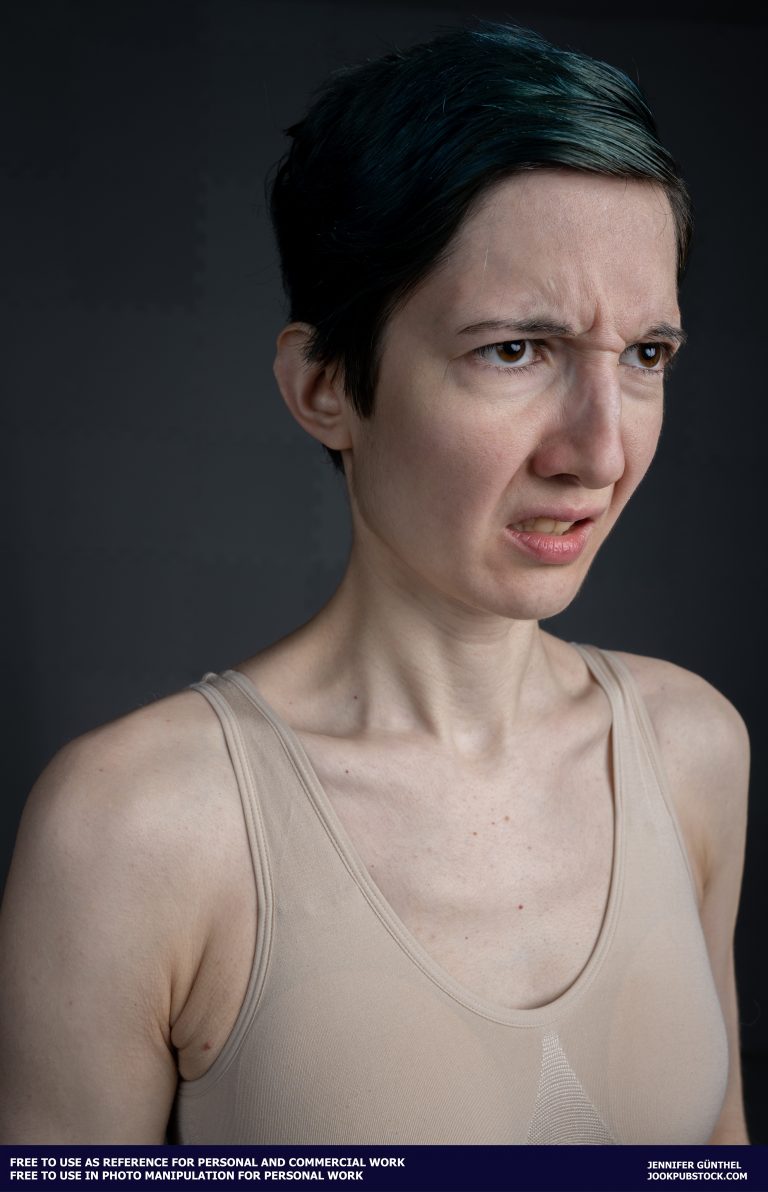 a person with short hair wearing a tank top
