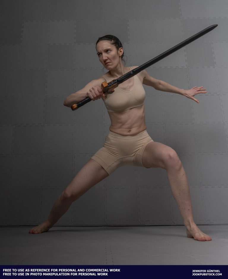 a person standing in a battle stance, holding a sword