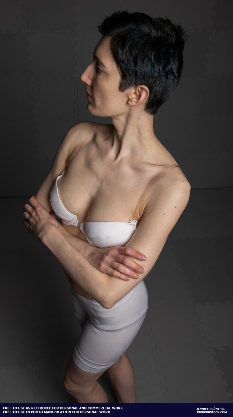 a person in white underwear with crossed arms