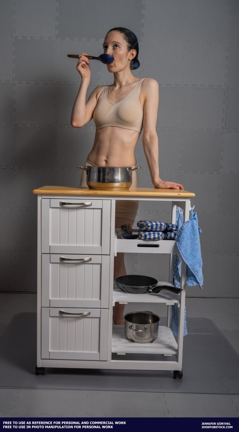 a person standing in front of a kitchen counter