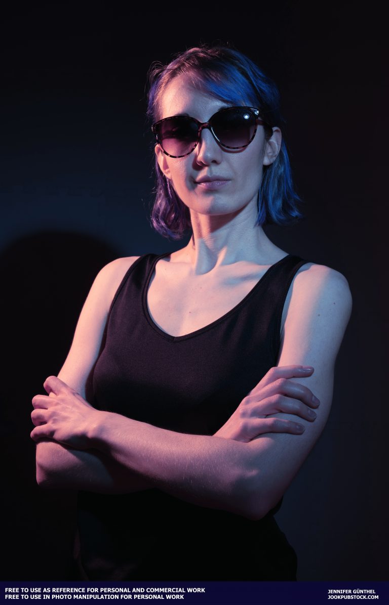 a person with blue hair wearing sunglasses