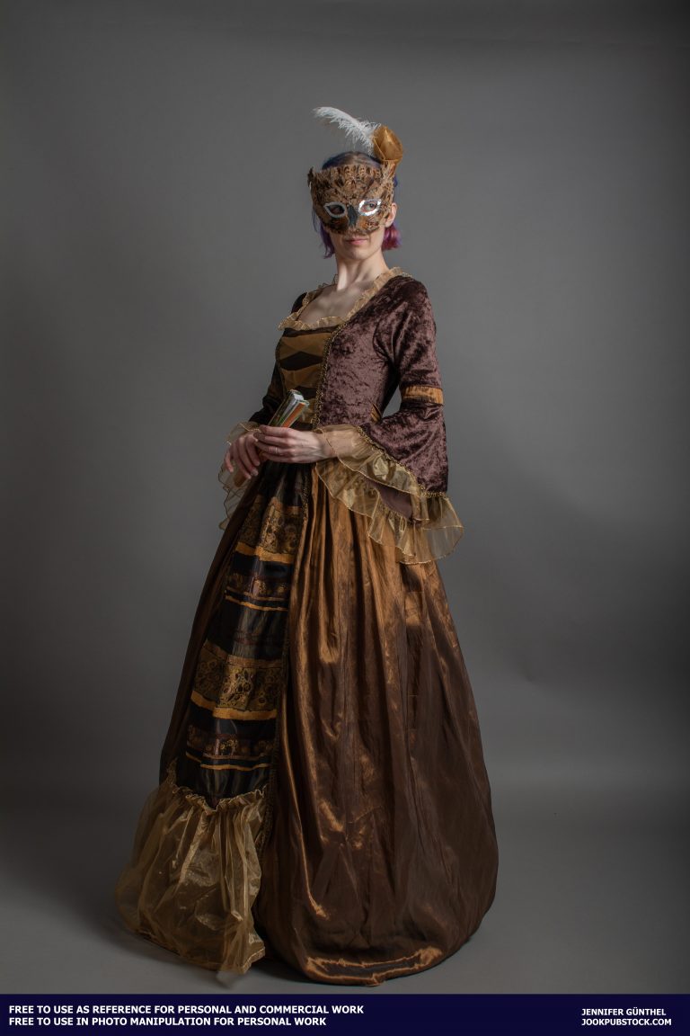 a person wearing a long dress and a mask