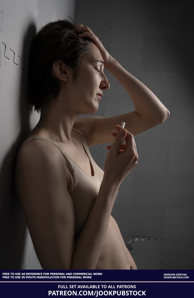 drawing reference photo of a model wearing form fitting underwear, holding a cigarette