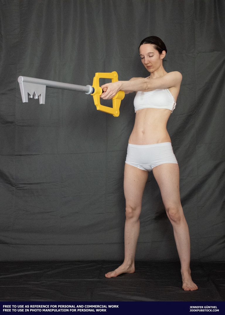 a person wearing form fitting underwear, holding a keyblade