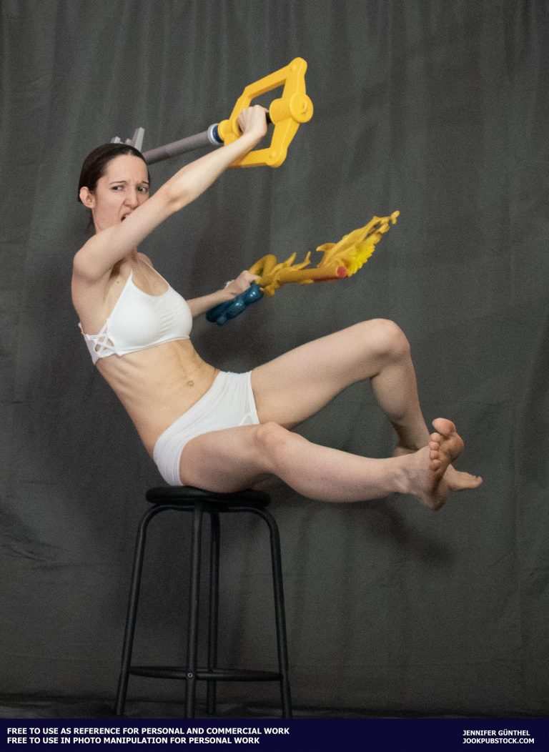a person wearing form fitting underwear, holding two keyblades