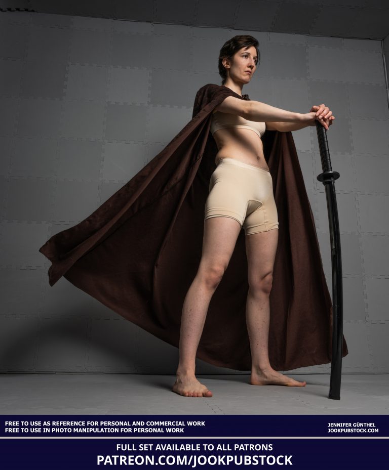 a person wearing form fitting underwear and a cloak, holding a sword